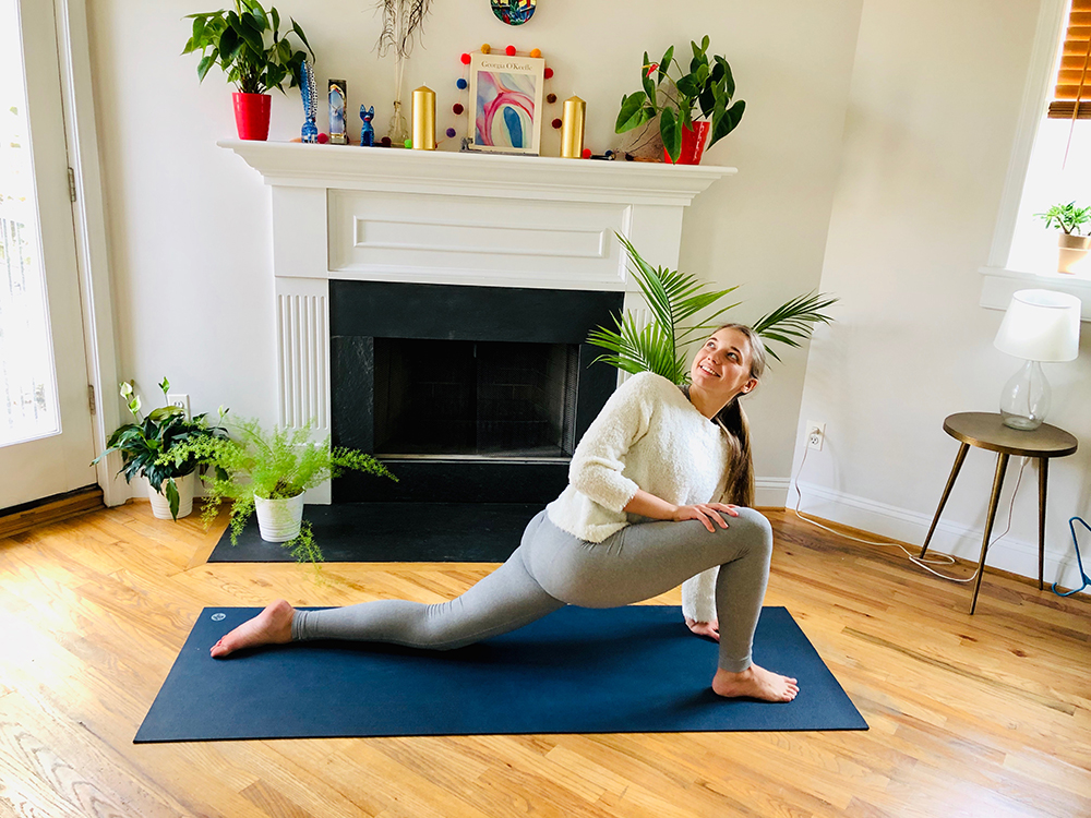 woman doing yoga in her living room